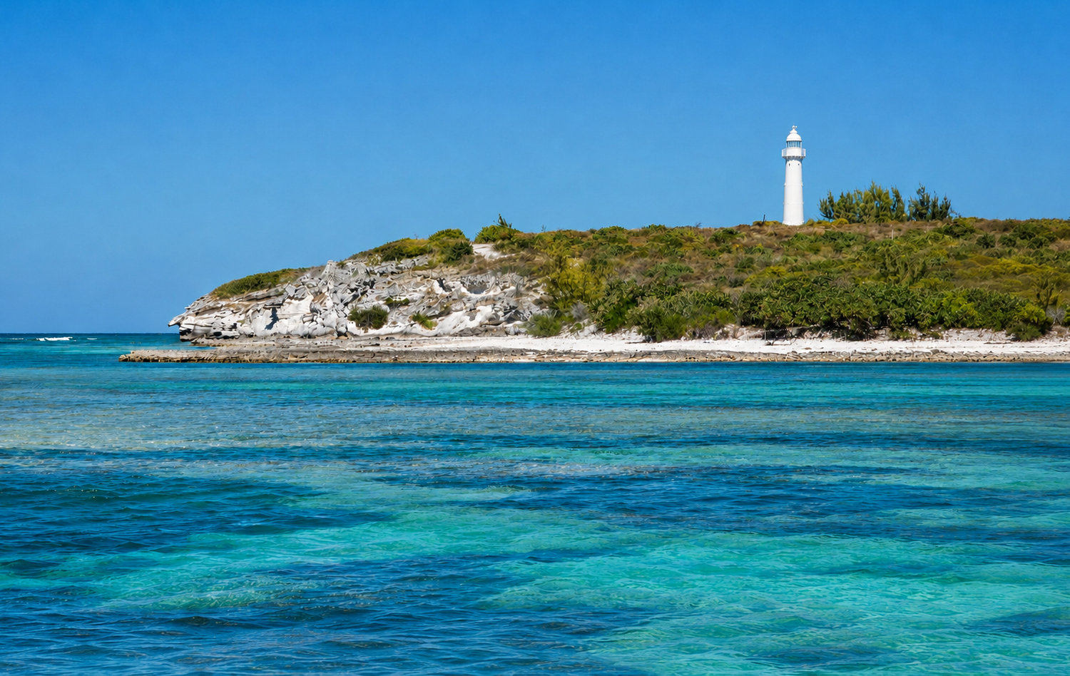 Grand Turk Lighthouse overlooking the turquoise coastal waters of Grand Turk, Turks and Caicos Islands